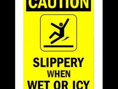 Sign caution slippery when wet or icy